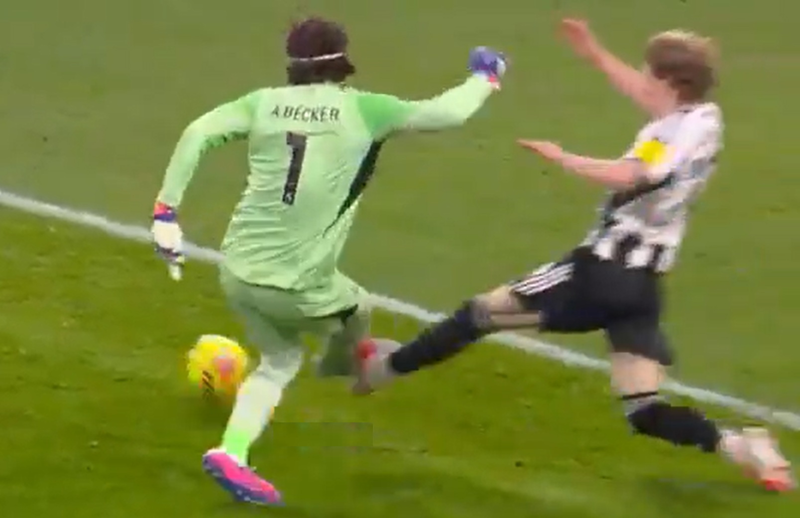 Anthony Gordon was booked for this challenge on Alisson Becker