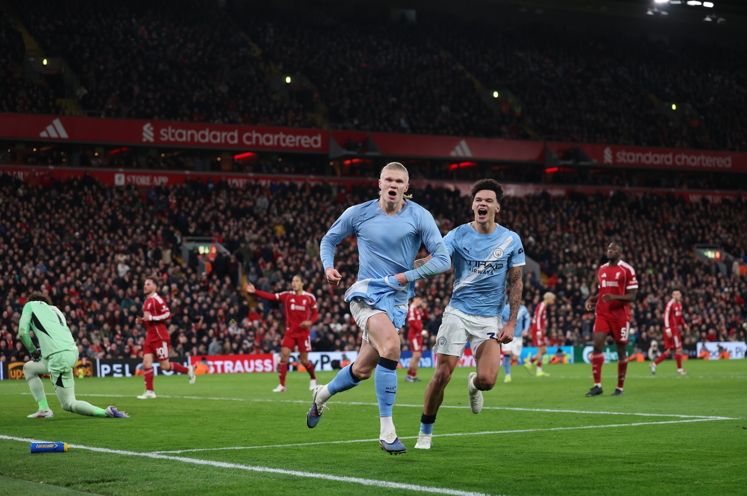 Erling Haaland celebrates scoring a stoppage-time winner at Anfield