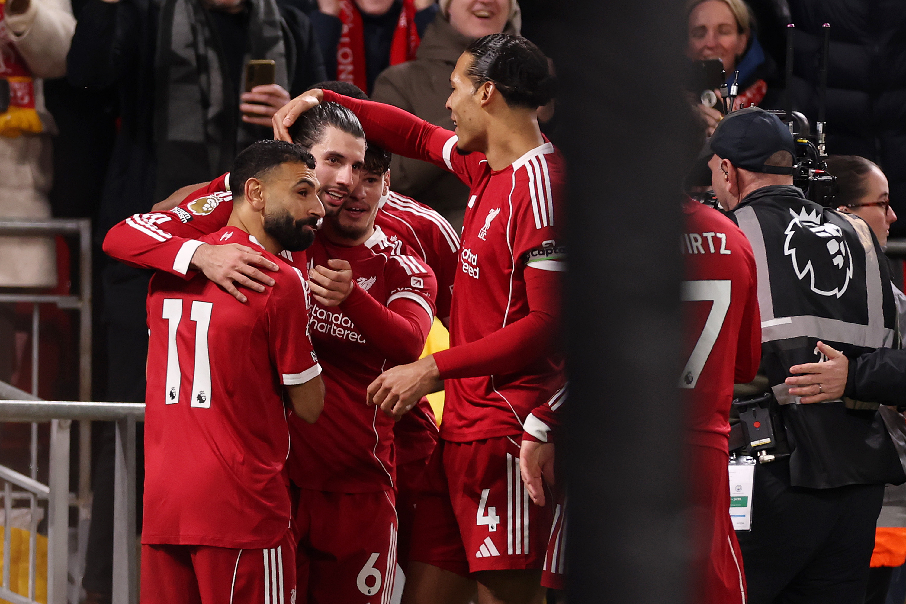 Liverpool players celebrate Dominik Szoboszlai's free kick goal against Manchester City