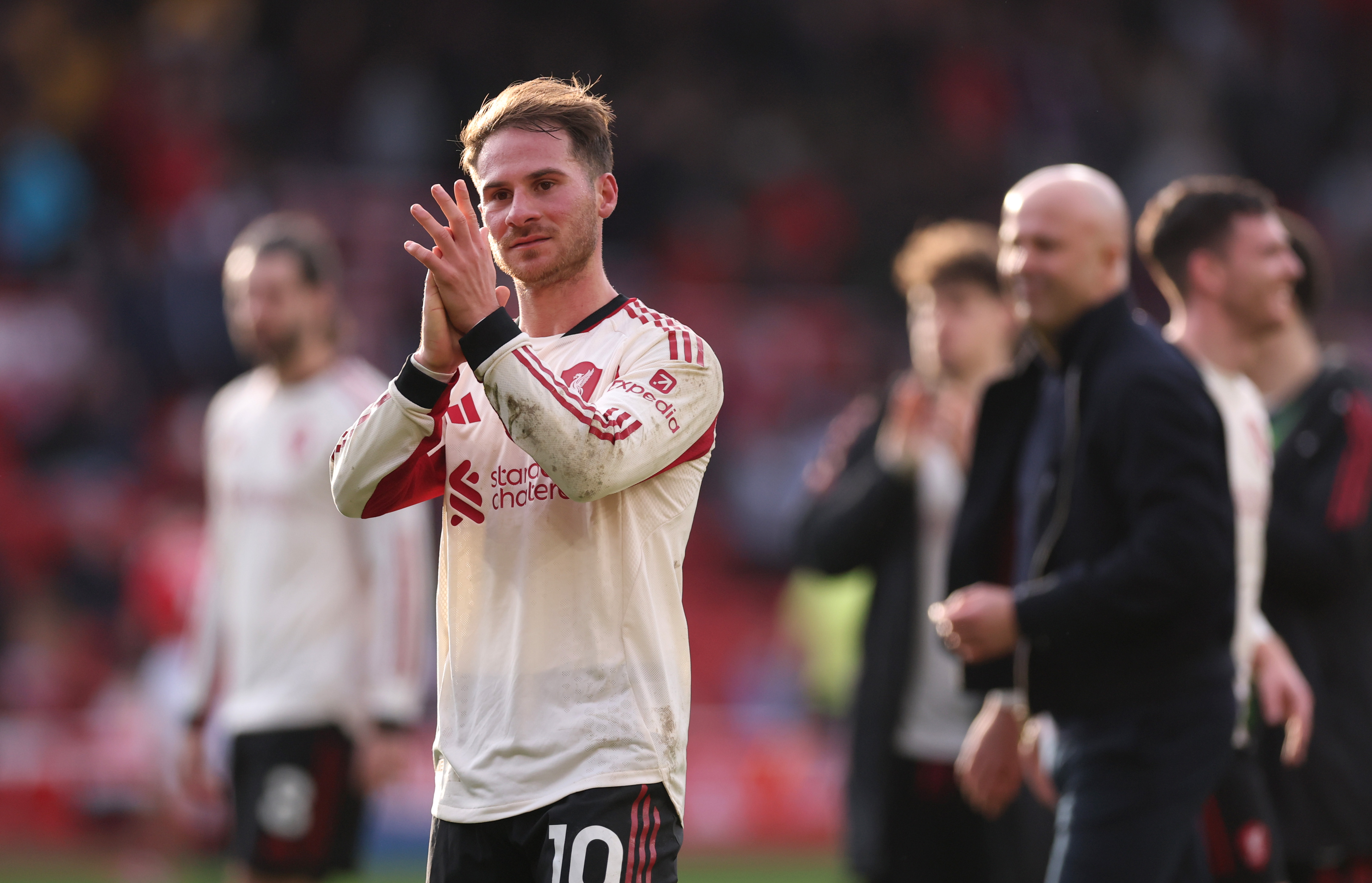 Alexis Mac Allister applauds the Liverpool fans after the win over Nottingham Forest