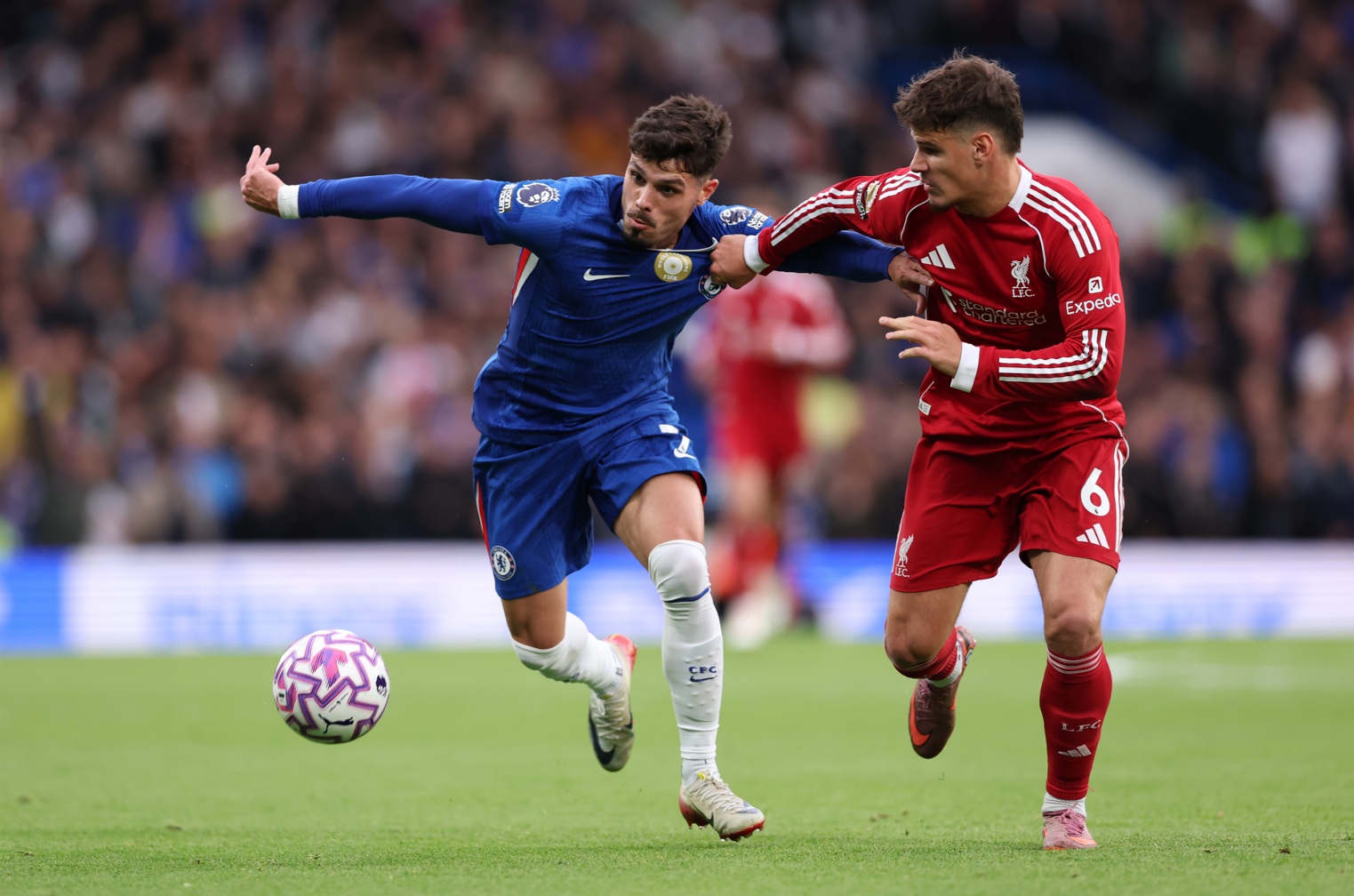 Pedro Neto and Milos Kerkez vie for possession