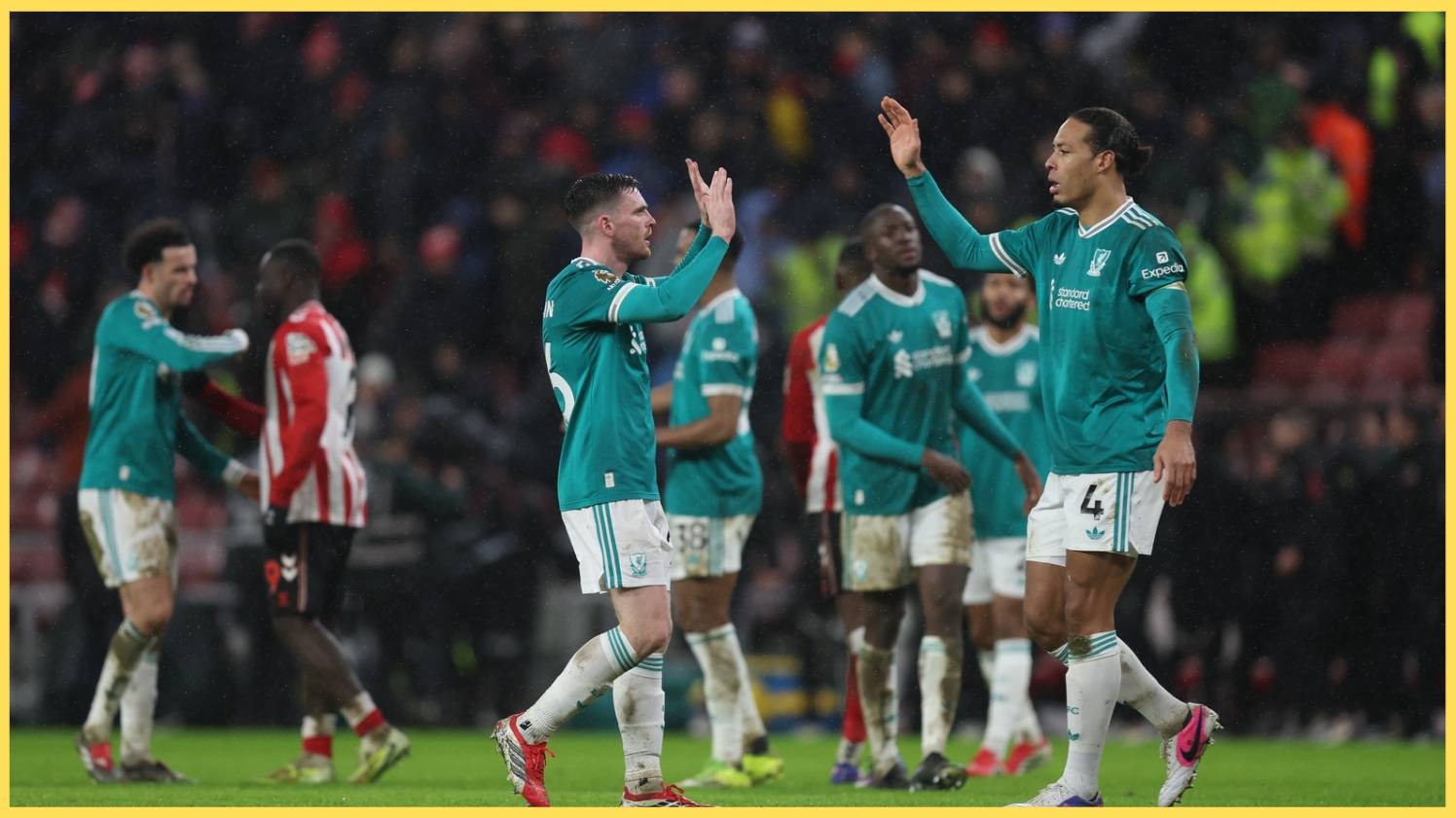 Andy Robertson and Virgil van Dijk celebrate after Liverpool's win over Sunderland