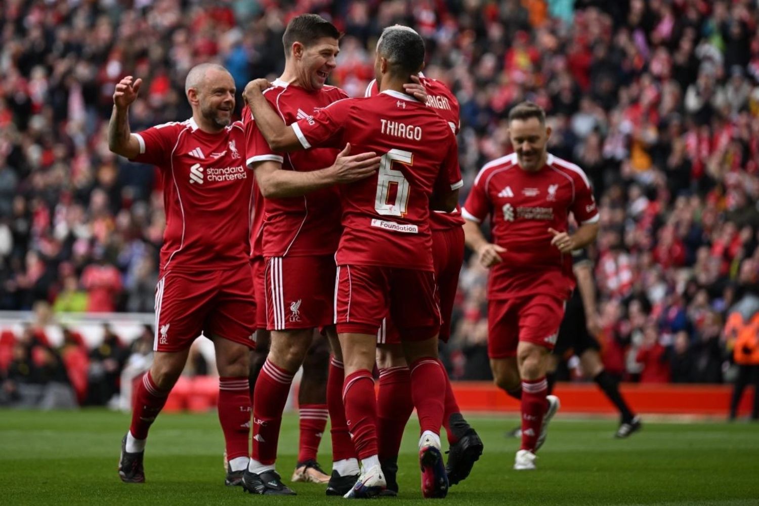 Thiago Alcantara celebrates with Steven Gerrard at Anfield for the Liverpool Legends game vs. Borussia Dortmund