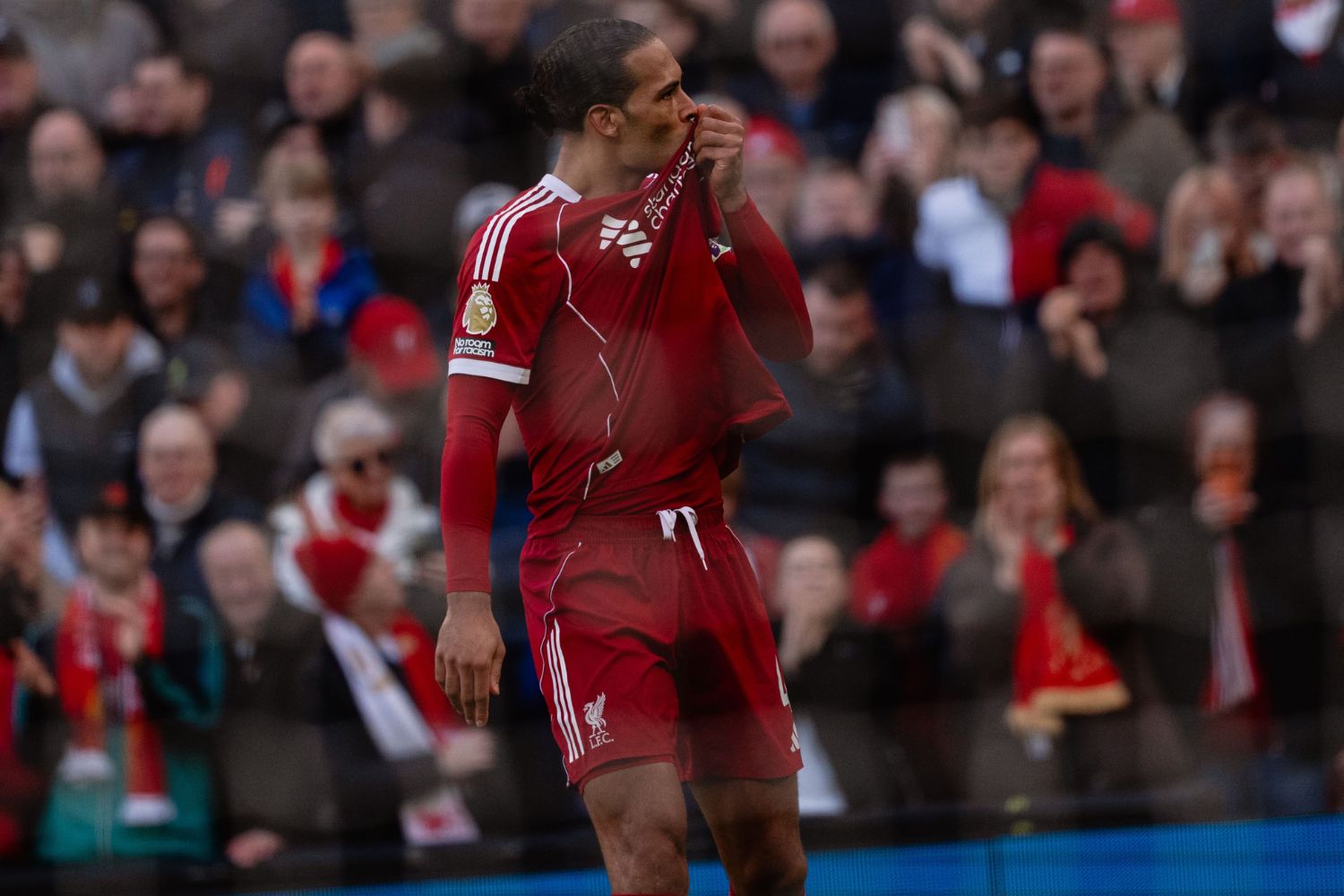 Virgil van Dijk kisses the Liverpool badge after scoring against West Ham