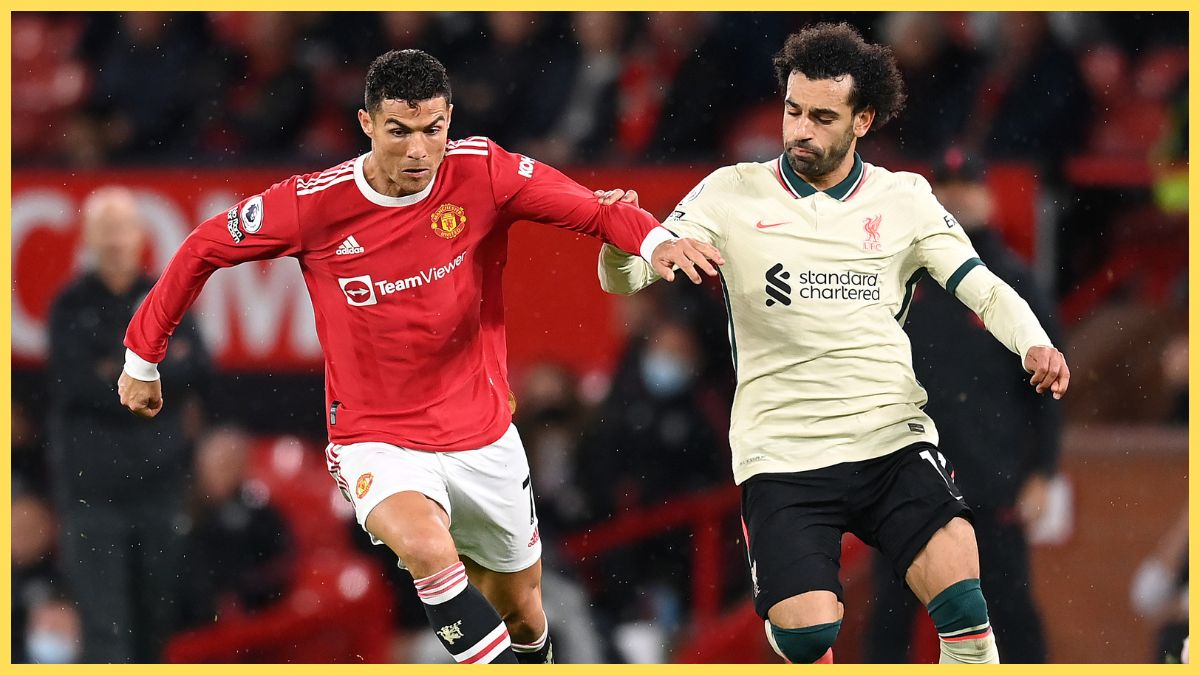Cristiano Ronaldo of Manchester United holds off Mohamed Salah of Liverpool during the Premier League match between Manchester United and Liverpool at Old Trafford on October 24, 2021