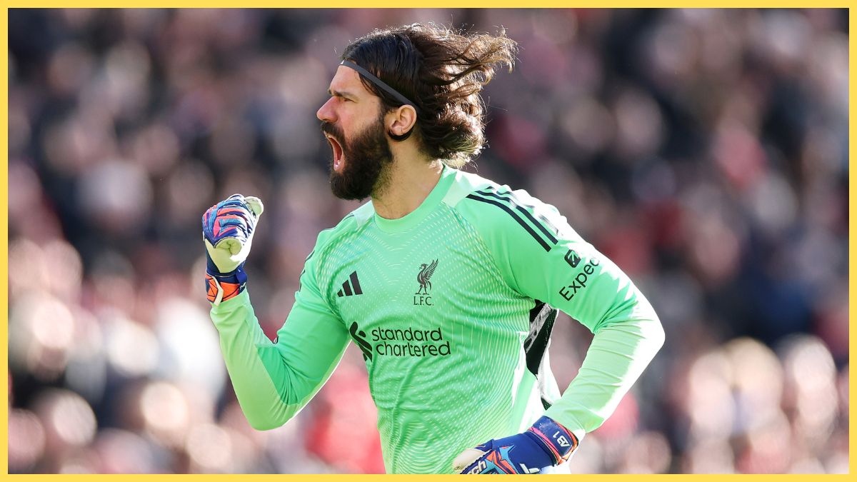 Alisson Becker of Liverpool celebrates after teammate Hugo Ekitike (not pictured) scored the team's first goal during the Premier League match between Liverpool and West Ham
