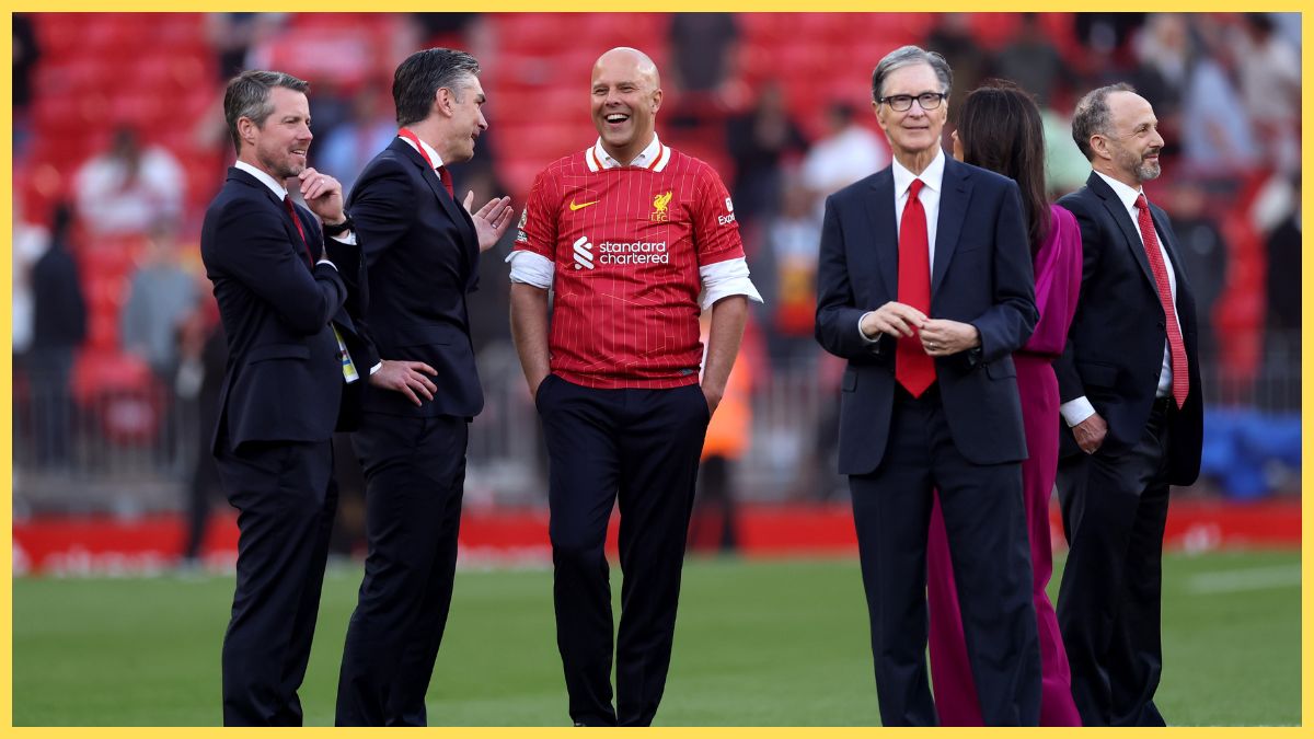Arne Slot, Manger of Liverpool, speaks to the Liverpool owners after the teams victory and confirmation of winning the Premier League title in the Premier League match between Liverpool FC and Tottenham Hotspur