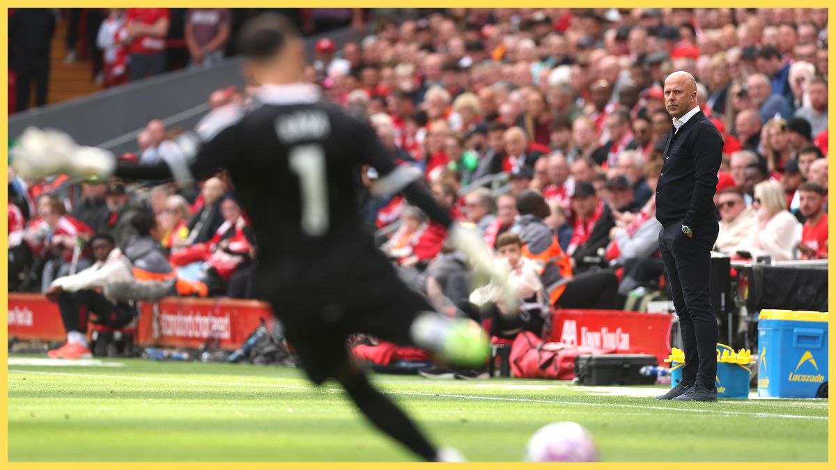 Arne Slot, Manager of Liverpool watches Arsenal goalkeeper David Raya take a free-kick