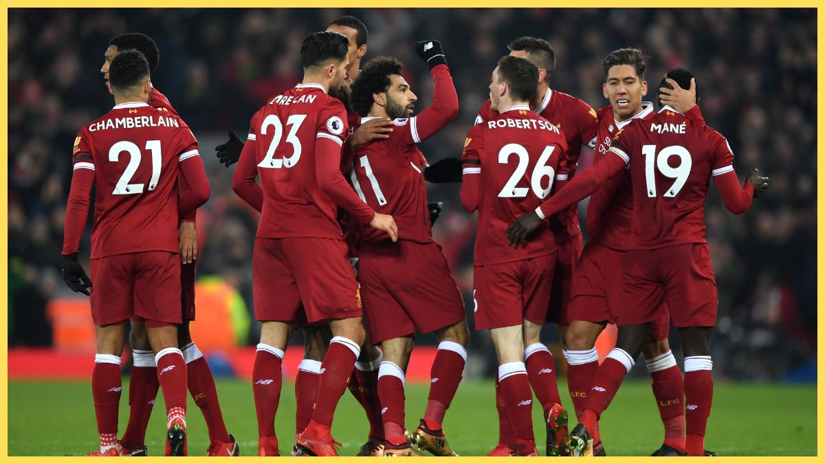 Mohamed Salah of Liverpool celebrates with team mates after scoring the fourth Liverpool goal during the Premier League match between Liverpool and Manchester City at Anfield on January 14, 2018