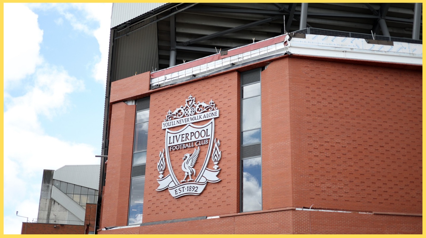 A picture of the official Liverpool FC crest on the exterior wall of Anfield