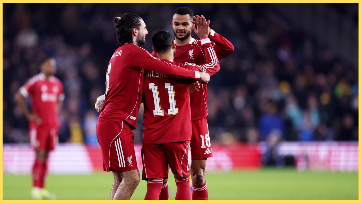 Liverpool players celebrate Mo Salah's goal against Wolves