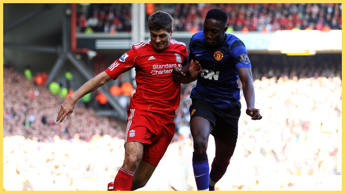 Steven Gerrard of Liverpool competes with Danny Welbeck of Manchester United