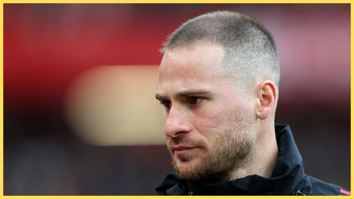 Alexis Mac Allister of Liverpool walks to the bench ahead of the Premier League match between Liverpool and Fulham at Anfield
