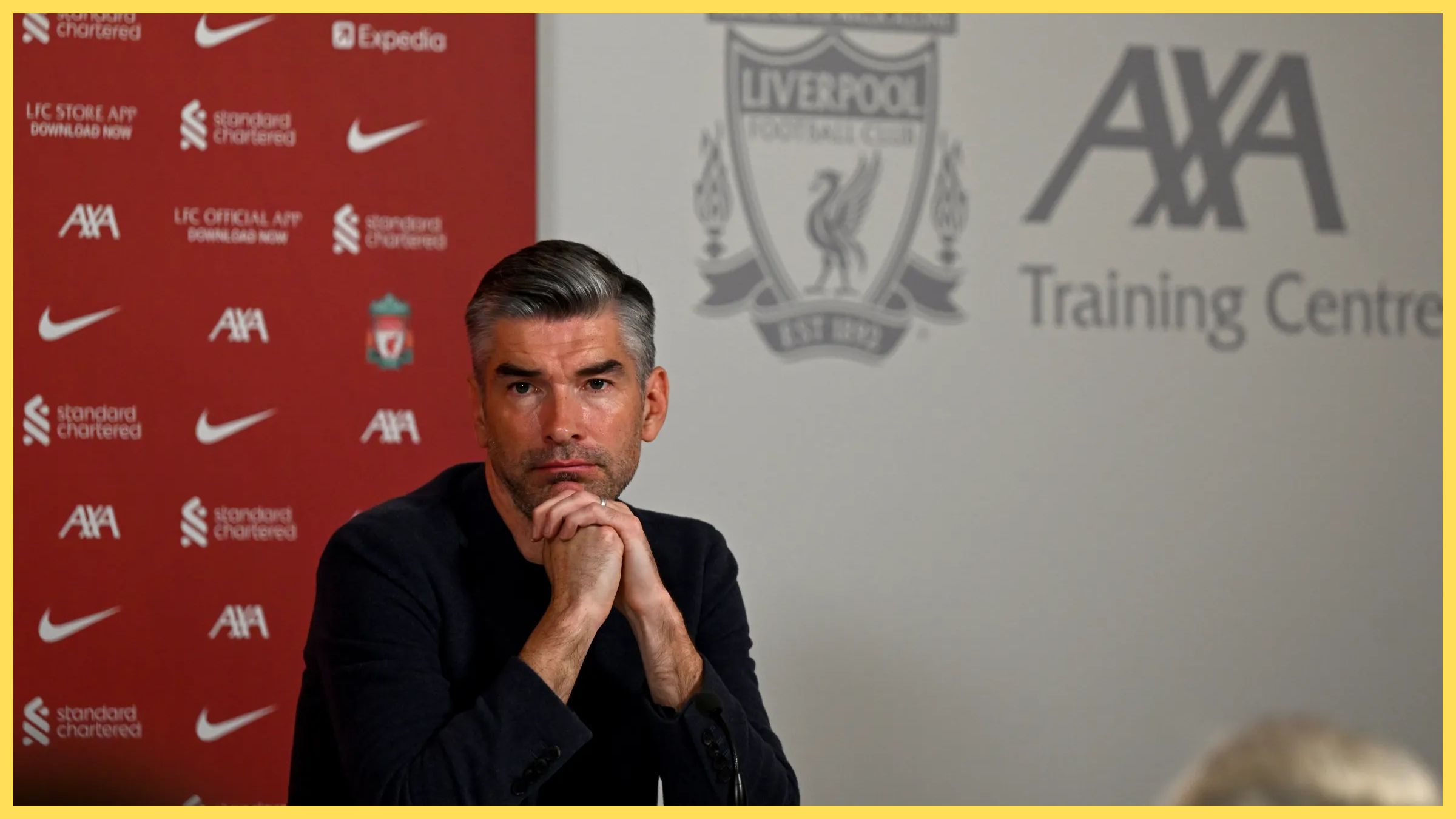 Richard Hughes rests his chin on his hands.