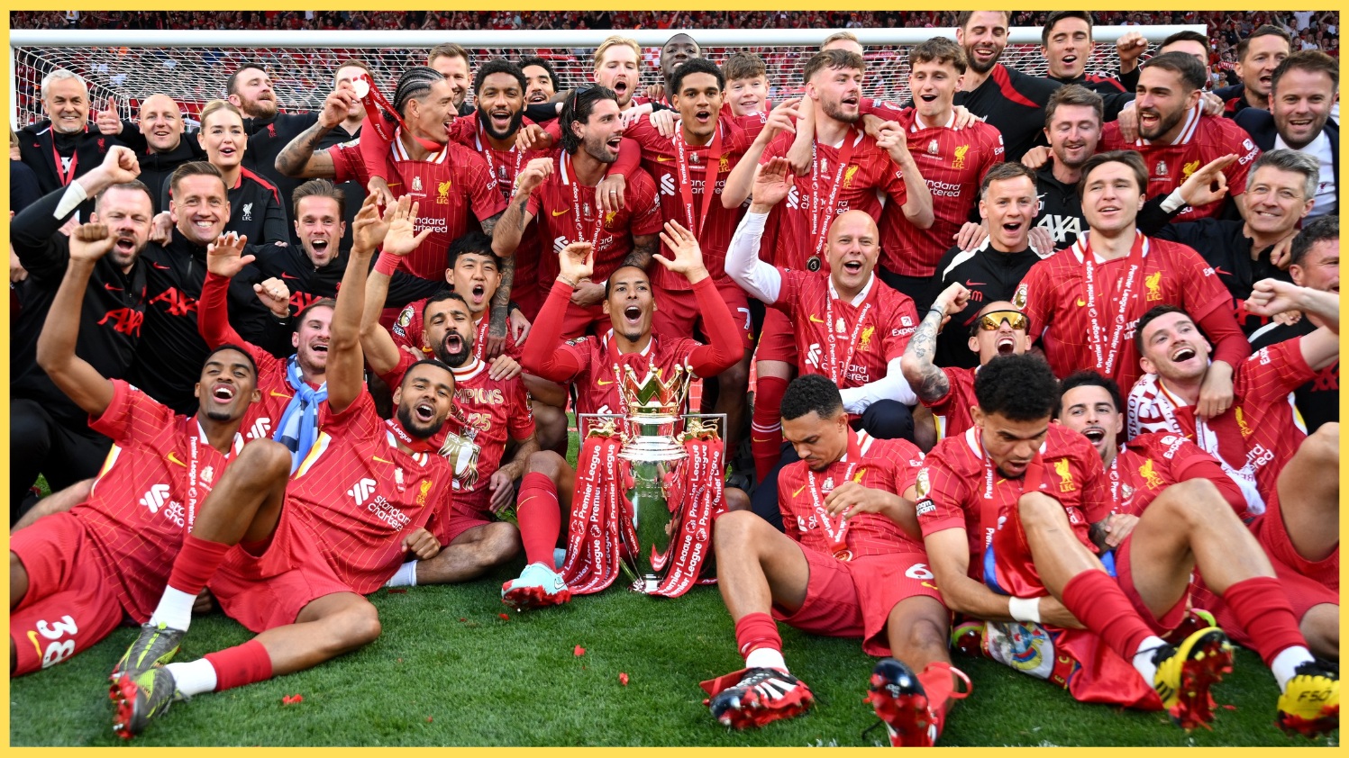 Liverpool players and staff celebrate with the Premier League trophy in May 2025