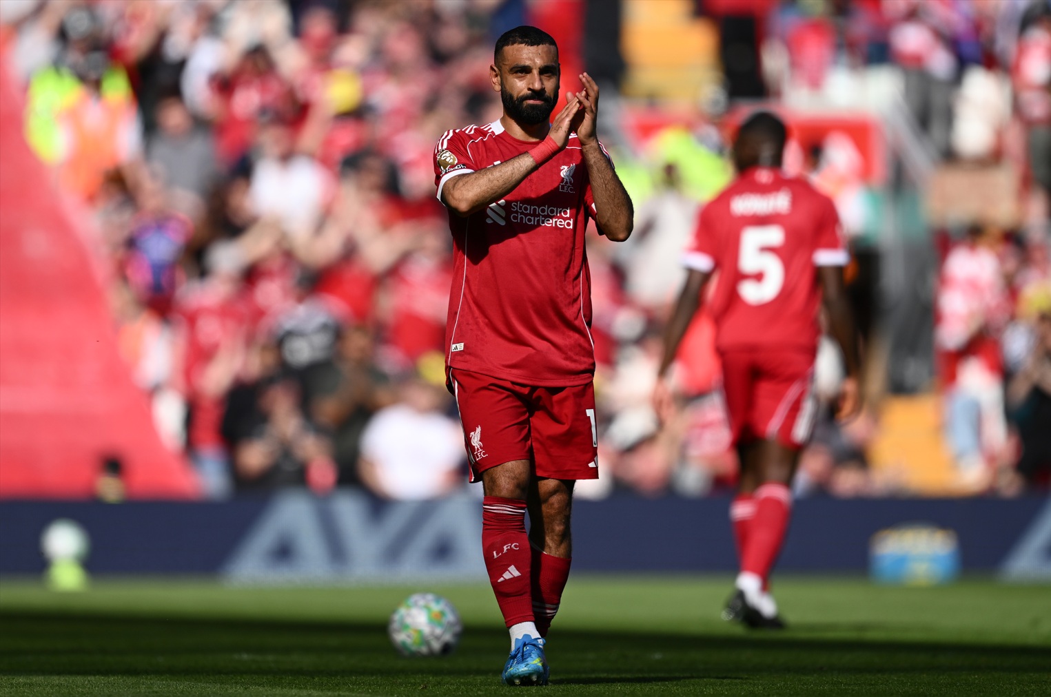 Mo Salah applauds the Liverpool fans after going off injured against Crystal Palace