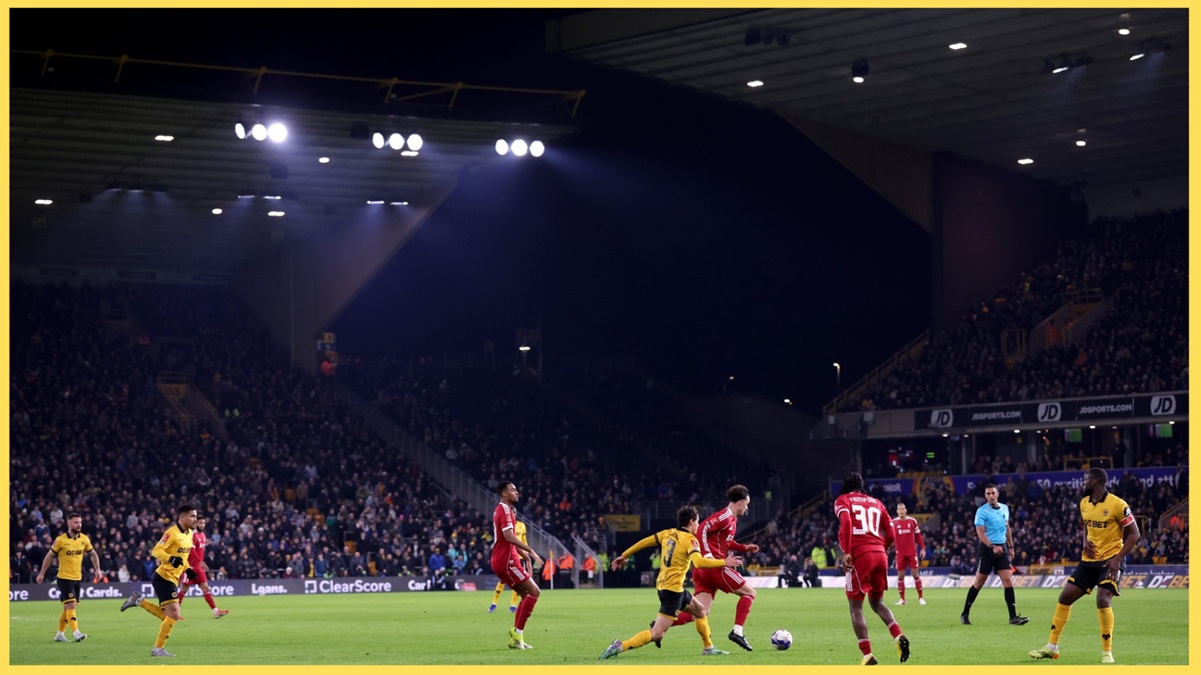 Curtis Jones evades the close attention of one Wolves player