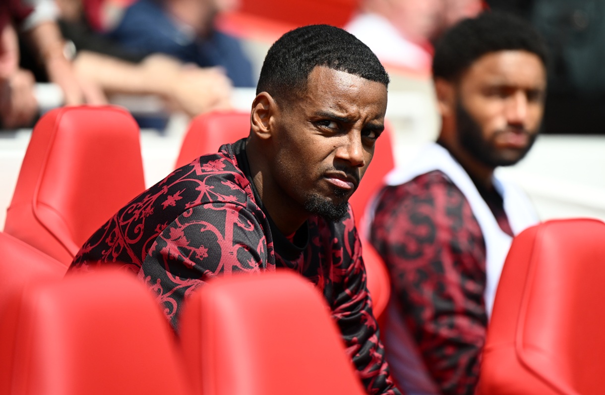 Alexander Isak watches on from the substitutes' bench at Anfield