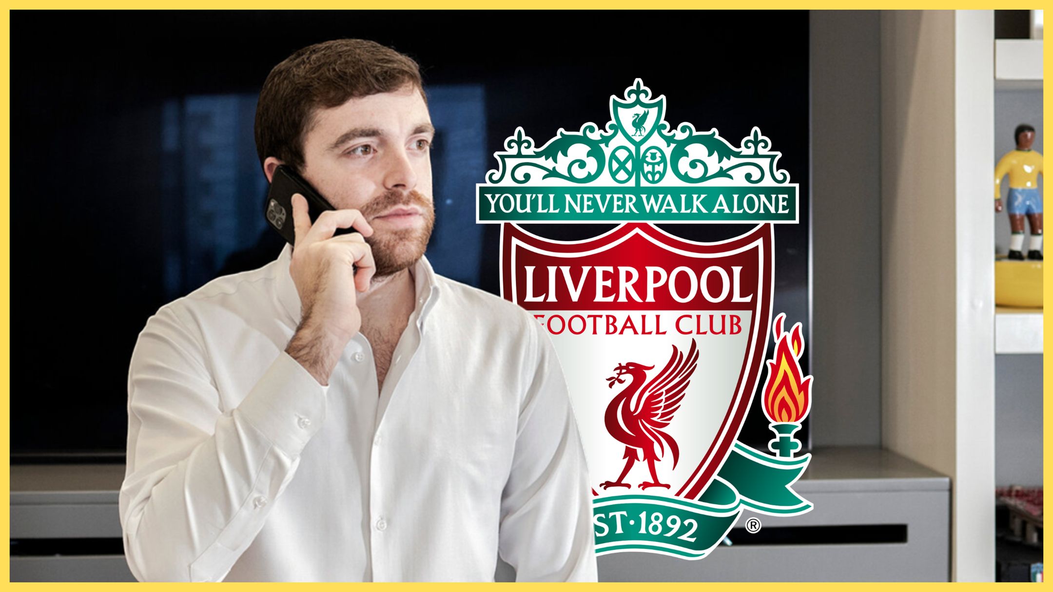 Transfer news expert Fabrizio Romano takes a phone call in front of a bookshelf and Liverpool club crest.