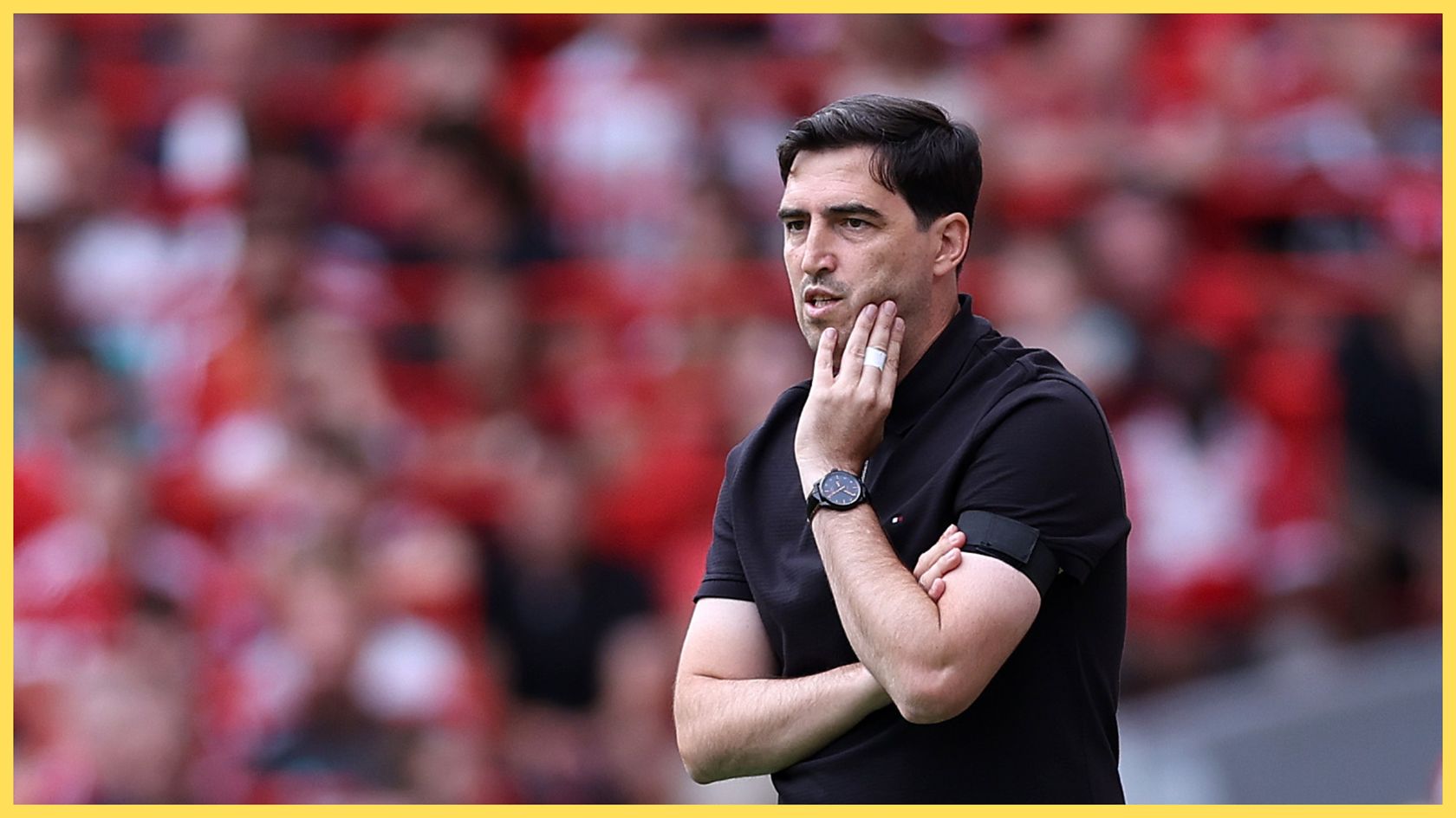 Liverpool manager Andoni Iraola touches his face during game vs Monaco.