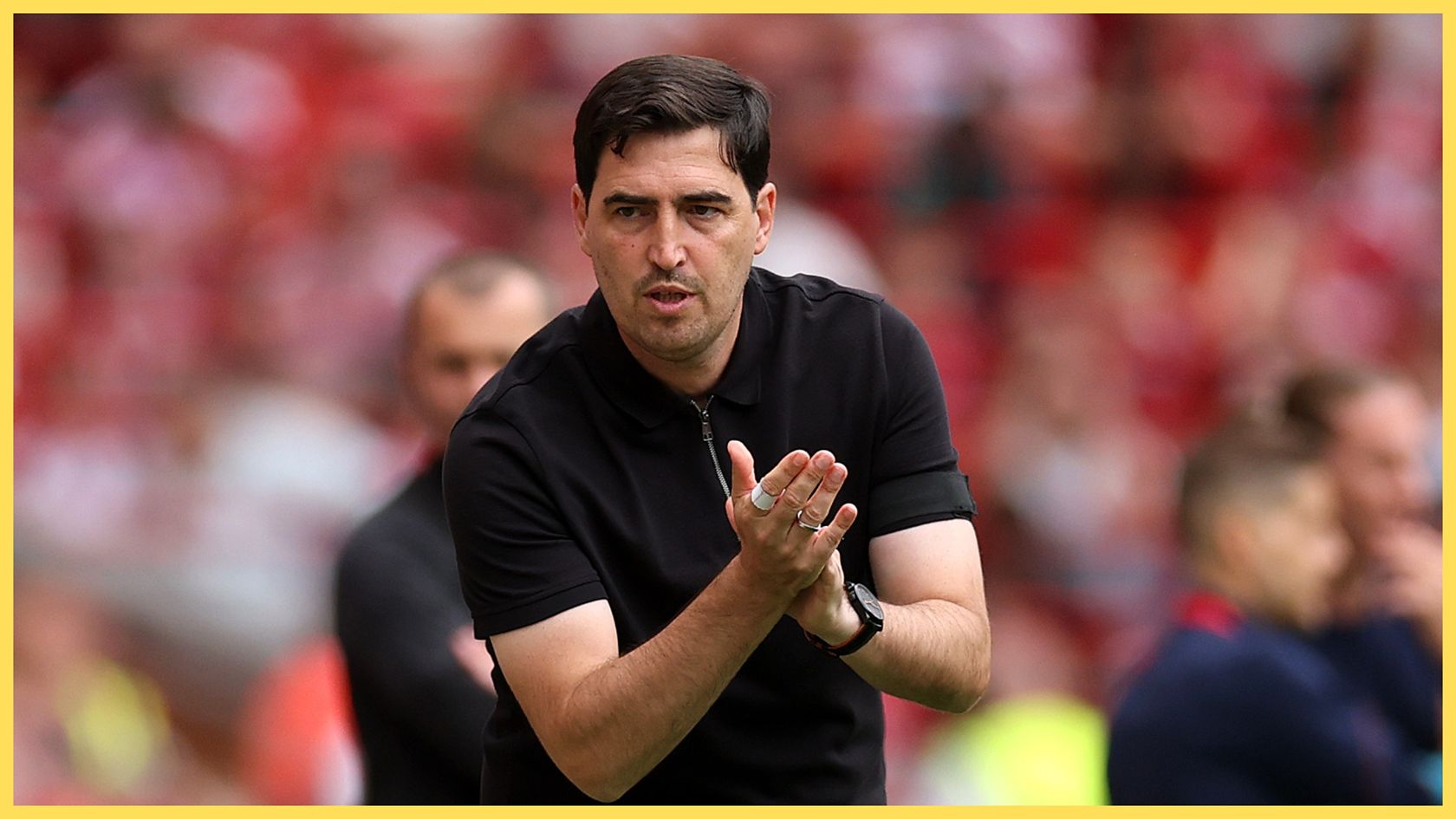 Liverpool manager Andoni Iraola claps his hands during Reds game.