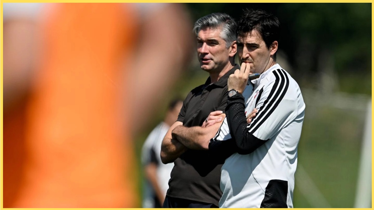 Richard Hughes and Andoni Iraola observe a Liverpool training session