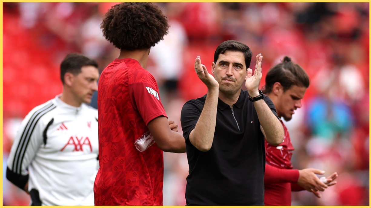 Andoni Iraola applauds the home fans at Anfield