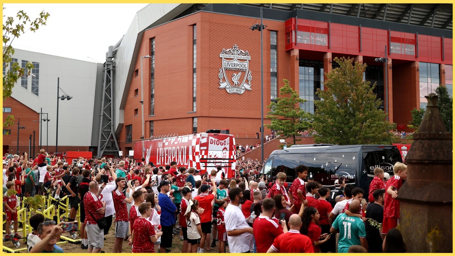 Liverpool fans gather for a glimpse of the team bus outside Anfield