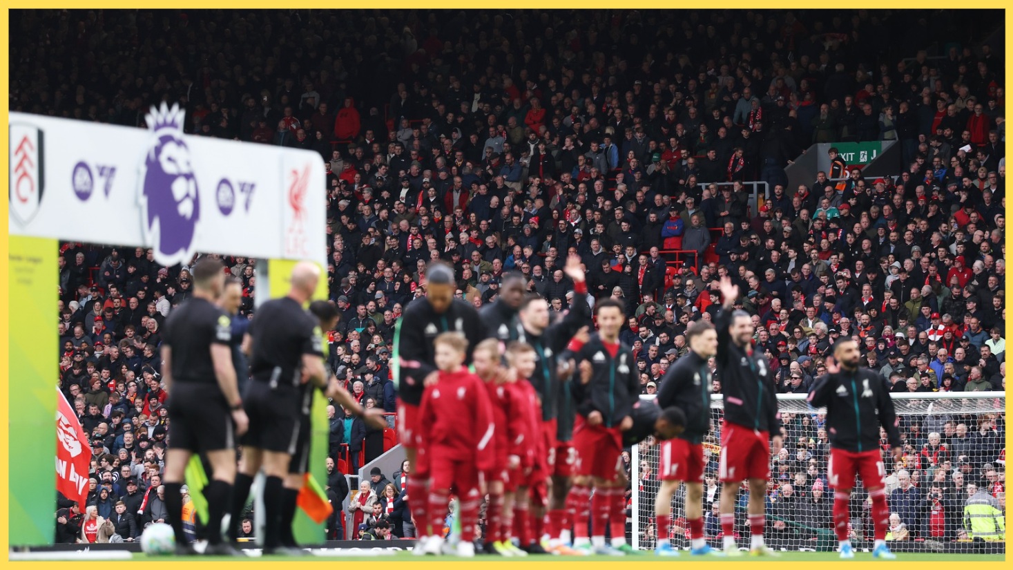 Liverpool players wave to the fans before a match at Anfield